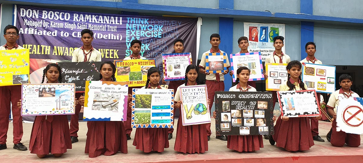 Students holding posters during Health Awareness Week at Don Bosco Ramkanali